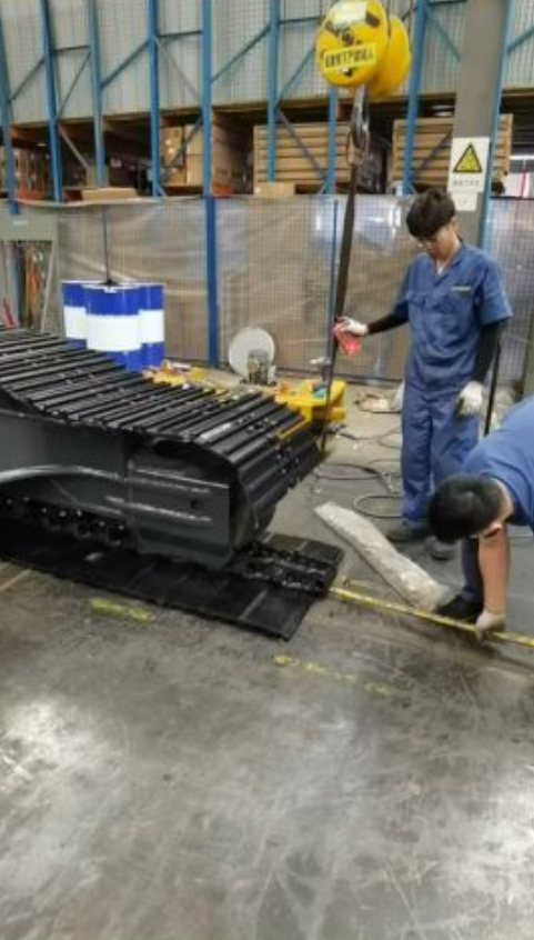Track Assembly of Excavators in Progress